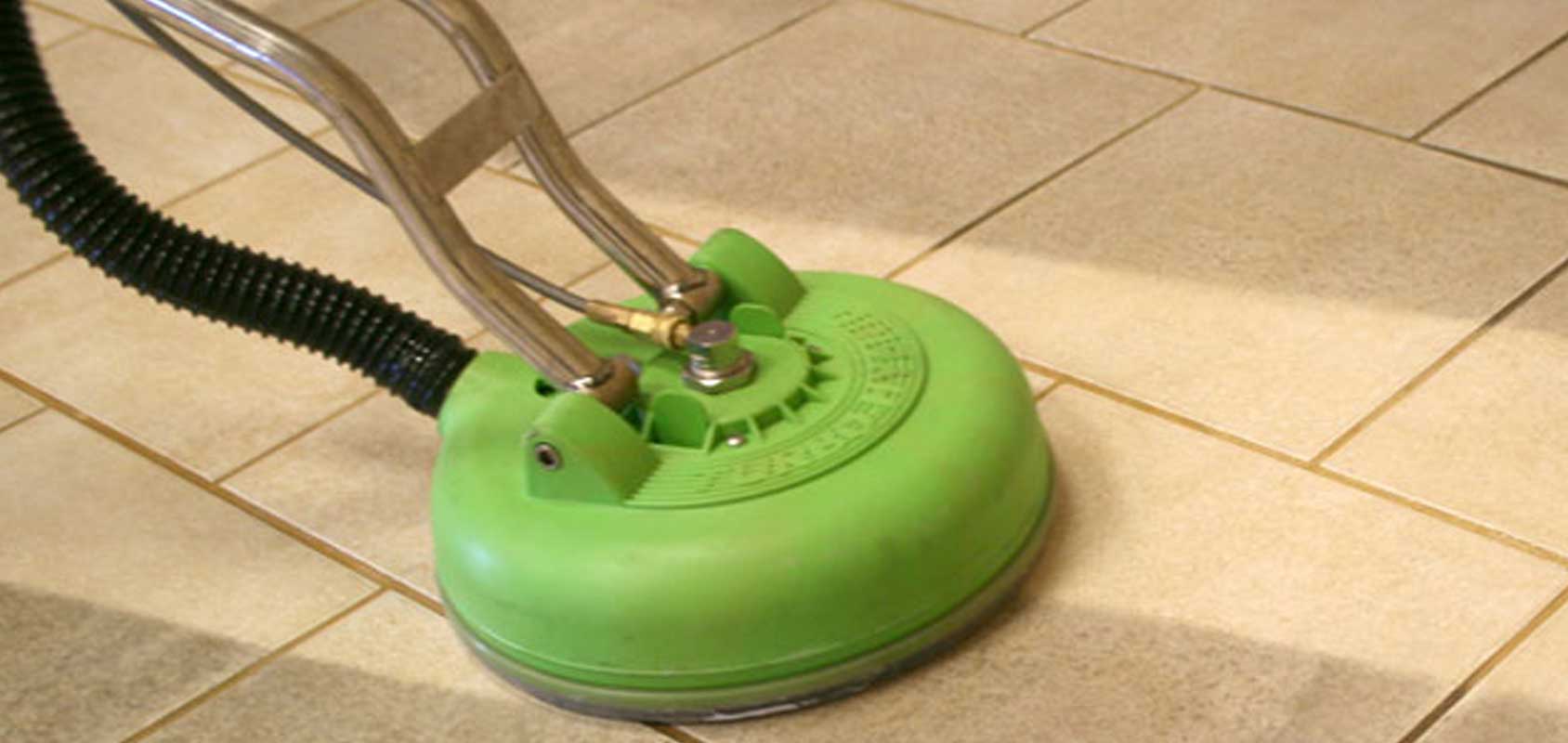 Tile floor being cleaned