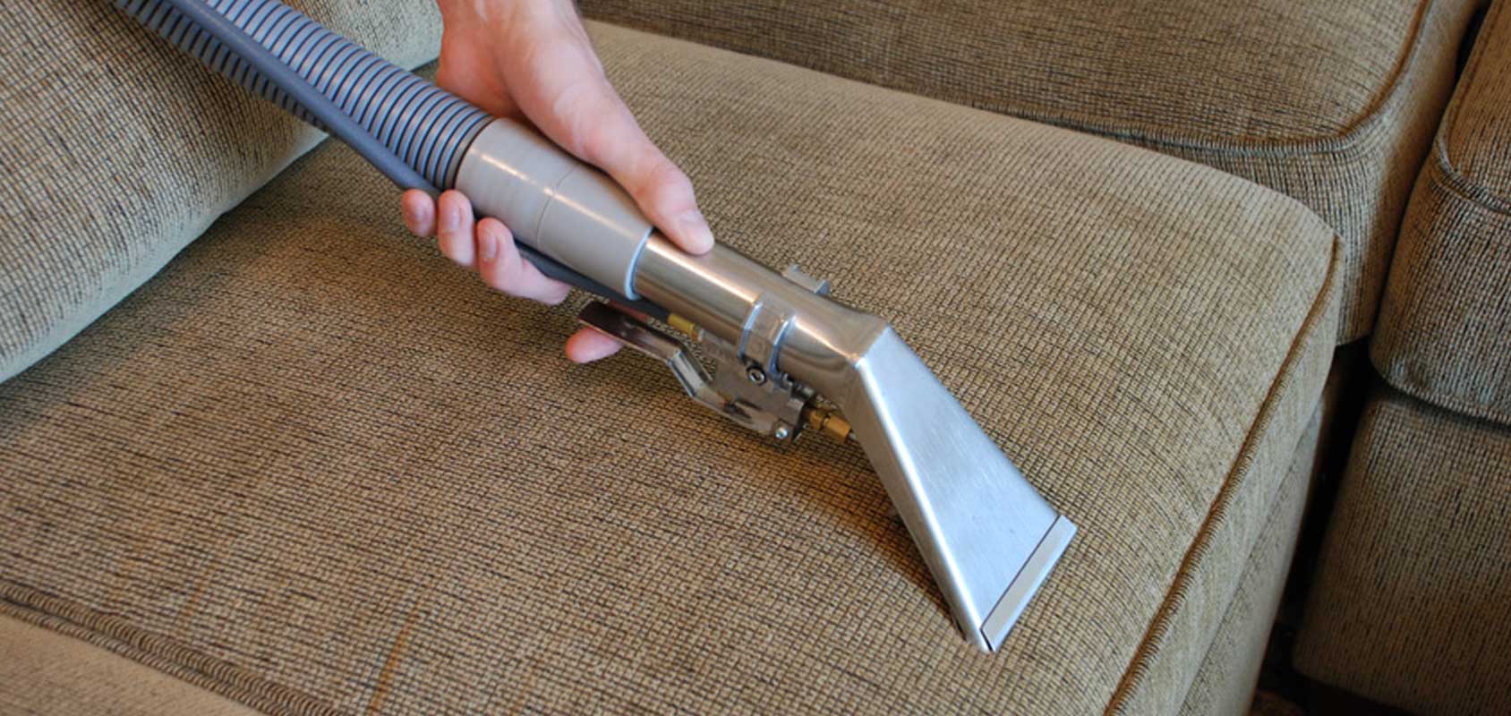 Upholstery being vacuumed